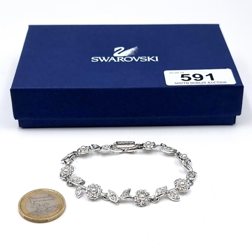 591 - A very pretty brand new Swarovski crystal bracelet set in a flower bloom design. Comes in original S... 