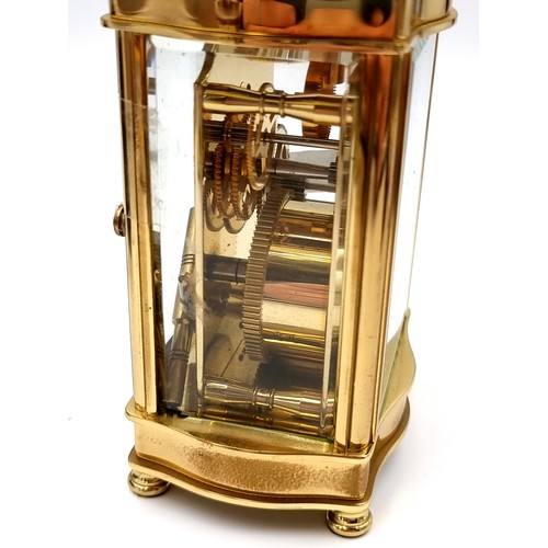 18 - A heavy Mallory Bath brass carriage clock with roman numeral dial. Comes with original key.