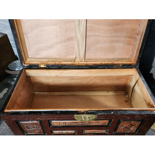 765 - A wonderful Chinese carved camphor wood chest with red lacquer.