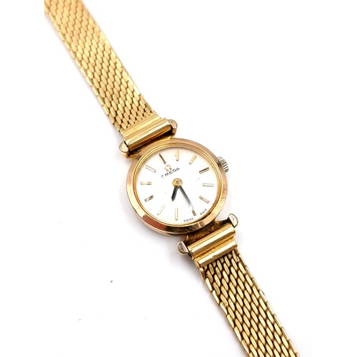 26 - Star Lot :A beautiful vintage Omega Swiss made ladies wrist watch with mesh straps and baton dial.