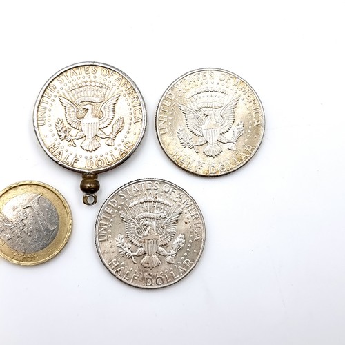 34 - Three 1964 90% silver John Kennedy half dollar silver coins together with a pendant. Items as per ph... 