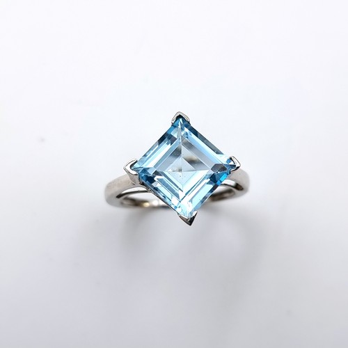 44 - Star Lot : A very pretty large blue topaz gemstone ring set in 14 carat white gold stamped 585. Ring... 