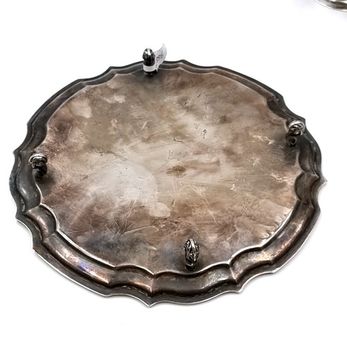 49 - Star Lot : A heavy vintage footed Irish silver circular tray set with a pie crust rim hallmarked Dub... 