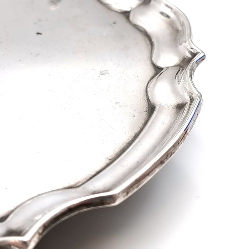 49 - Star Lot : A heavy vintage footed Irish silver circular tray set with a pie crust rim hallmarked Dub... 