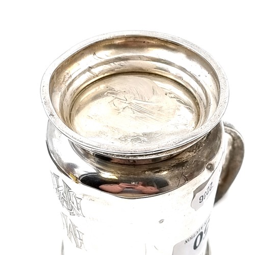 50 - Star Lot : A good example of a vintage sterling silver tankard set with a flying C handle hallmarked... 