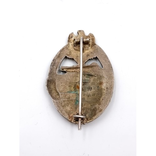 526 - An original  WWII German tank assault badge with pin present at rear. Stamped 