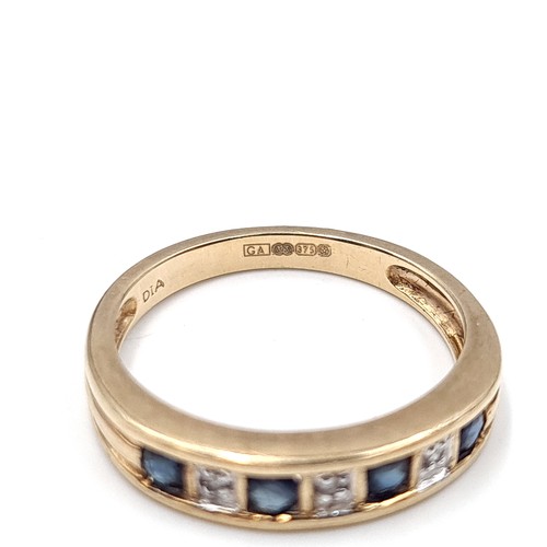 601 - Star Lot : A sapphire and diamond ring set in nine carat gold. Stamped 375. Size N. Weight 2.57 gram... 