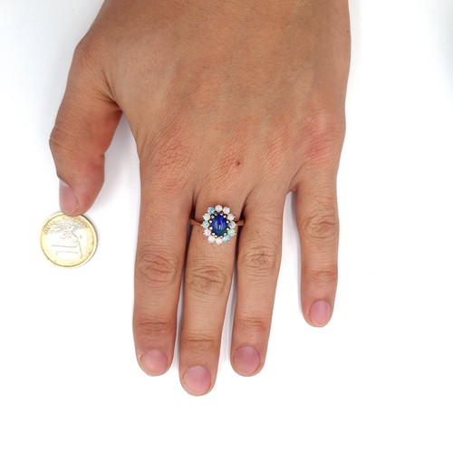 603 - Star Lot : An elaborate antique multi opal gemstone ring, With 11 fire opals and a beautiful large B... 