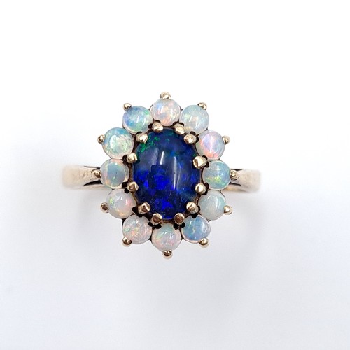 603 - Star Lot : An elaborate antique multi opal gemstone ring, With 11 fire opals and a beautiful large B... 