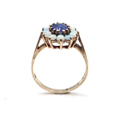 603 - Star Lot : An elaborate antique multi opal gemstone ring, With 11 fire opals and a beautiful large B... 