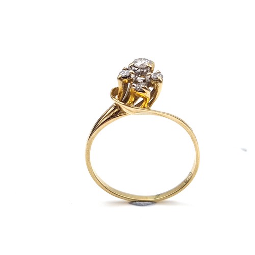 617 - An unusual graduated diamond ring set in 18 carat gold. Stamped 750 to band. Size I. Weight 1.64 gra... 