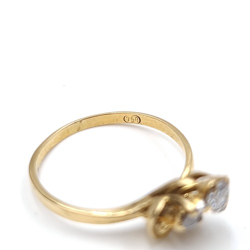 617 - An unusual graduated diamond ring set in 18 carat gold. Stamped 750 to band. Size I. Weight 1.64 gra... 