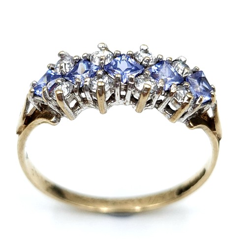 610 - Star Lot : A wonderful tanzanite and gemstone ring set in nine carat gold. Stamped 375. Size M. Weig... 