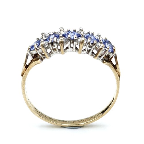 610 - Star Lot : A wonderful tanzanite and gemstone ring set in nine carat gold. Stamped 375. Size M. Weig... 