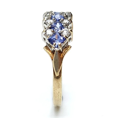 610 - Star Lot : A wonderful tanzanite and gemstone ring set in nine carat gold. Stamped 375. Size M. Weig... 