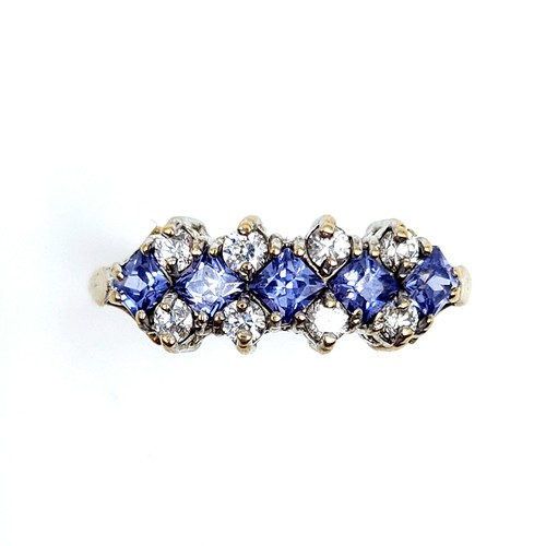 610 - Star Lot : A wonderful tanzanite and gemstone ring set in nine carat gold. Stamped 375. Size M. Weig... 