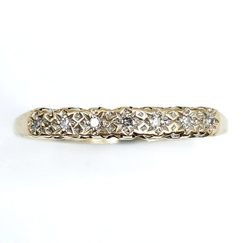 609 - An eye catching diamond ring set in nine carat gold. Stamped 375. Size O. Weight 1.16 grams. Boxed.