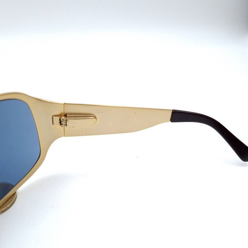 503 - A pair of gold toned Eley-Kishimoto sunglasses marked 'Eley Kishimoto' EK#G3 on frame. Lenses in goo... 