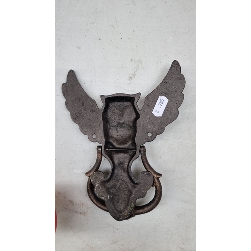 403 - Bronze owl-shaped door knocker, intricately detailed with spread wings. Cast bronze material.