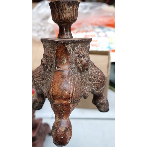 405 - Pair of tall antique style wooden candlesticks with intricate carvings and tripod lion feet, from th... 