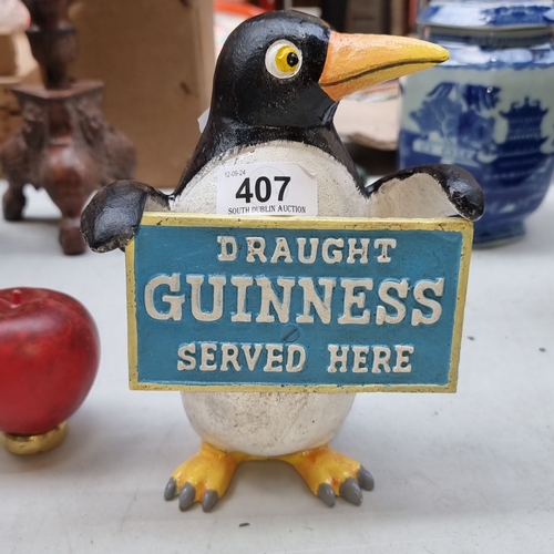 407 - Hand-painted heavy cast metal  penguin holding a 