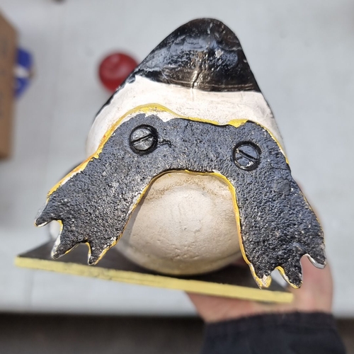 407 - Hand-painted heavy cast metal  penguin holding a 