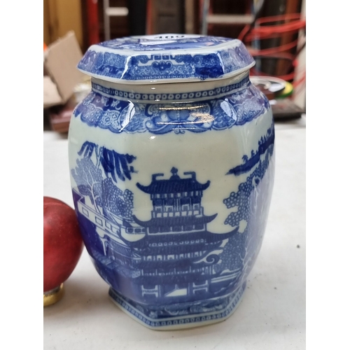 409 - Blue and white porcelain ginger jar features traditional Chinese pagoda and landscape motifs, hexago... 