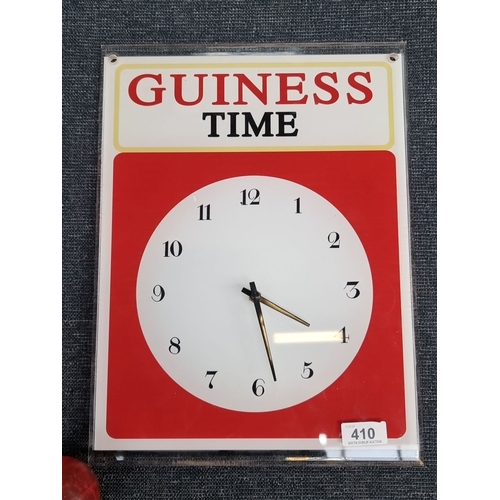 410 - Vintage Guinness Time wall clock with bold red, white, and black design. Analog display with hour, m... 