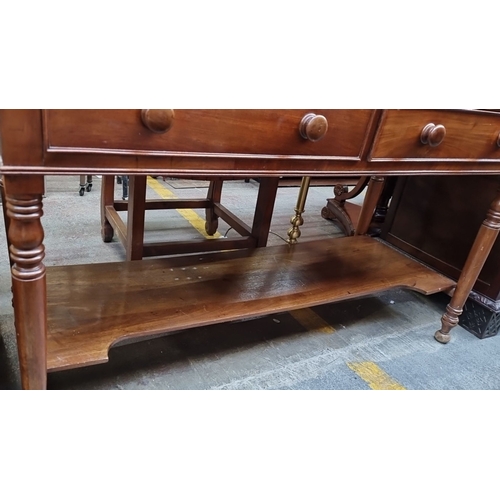 412 - Star Lot : A lovely Victorian mahogany writing desk with raised back, featuring two drawers and turn... 