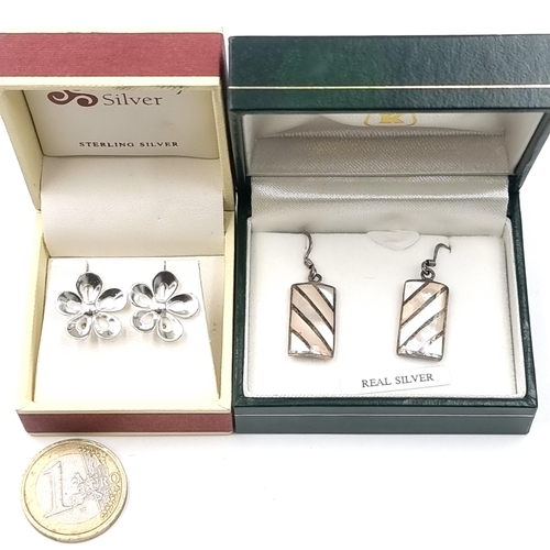 20 - Two pairs of Kilkenny silver earrings (one pair stud & one pair suitable for pierced ears). Boxed.