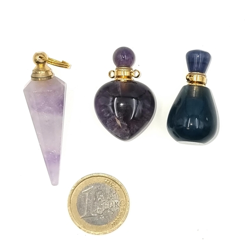 33 - A collection of three polished stone perfume bottles. Stone cold to touch. Total weight - 34.7 grams... 