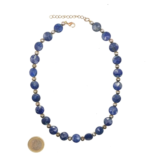 37 - A nice quality Lapis Lazuli necklace with bead set accents set with lobster clasp. Length - 42 cms. ... 