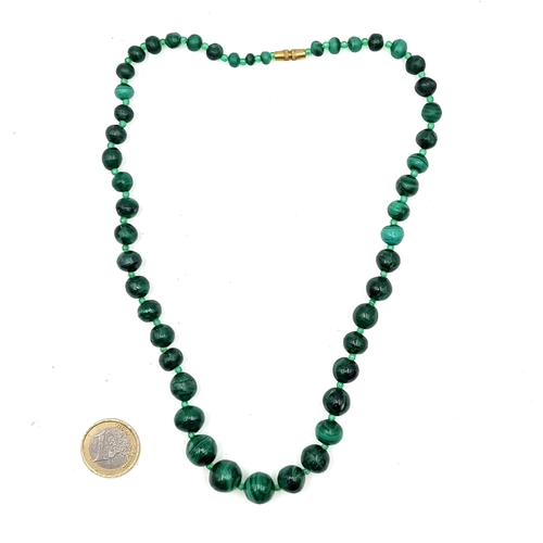 51 - A graduated vintage malachite necklace in screw twist clasp. Length - 44 cms. Weight - 72.63 grams. ... 