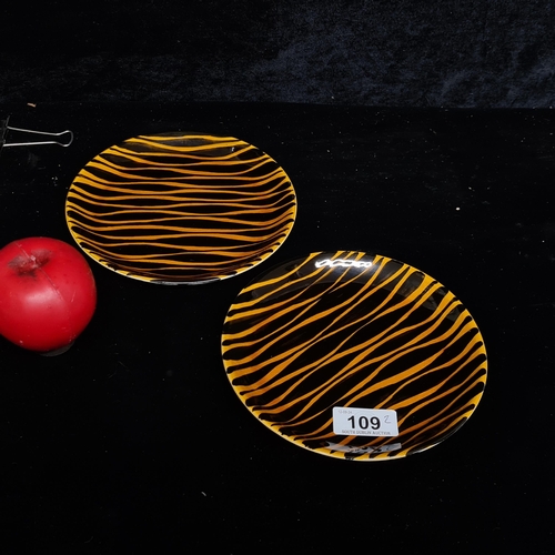 109 - Two John Ffrench Arklow Studio Pottery side plates in a very funky black and yellow ochre pattern. B... 