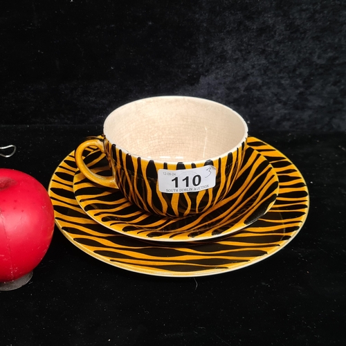 110 - A John Ffrench Arklow Studio Pottery cup, saucer and side plate in a matching attractive black and o... 