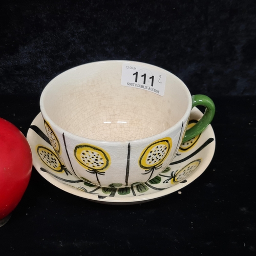 111 - A rare John Ffrench Arklow Studio Pottery cup and saucer featuring a stylized sunflower pattern. Lov... 