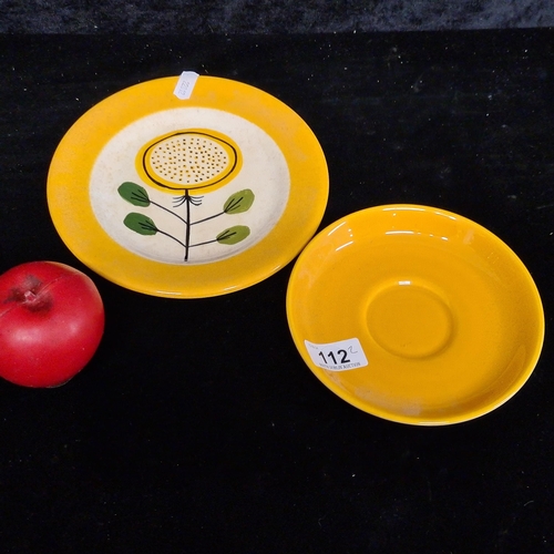 112 - A John Ffrench Arklow Studio Pottery saucer and side plate in a vibrant yellow glaze with one featur... 