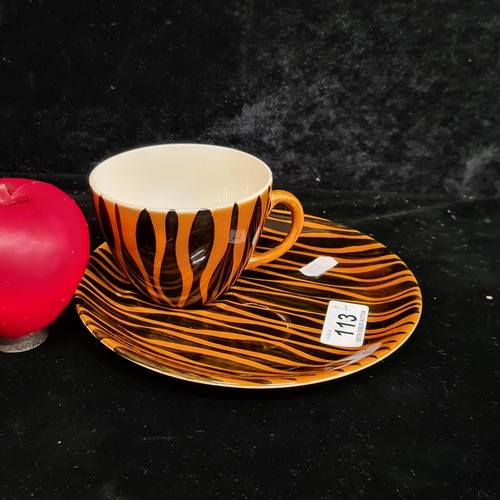 113 - A John Ffrench Arklow Studio Pottery cup and sandwich plate. . Both in a matching striking black and... 