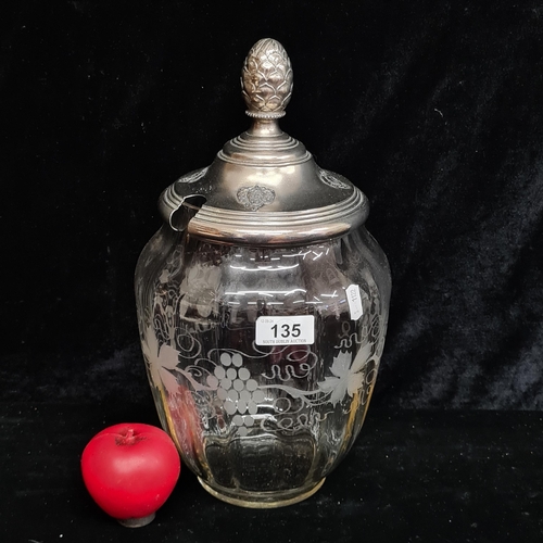 135 - A large vintage ribbed glass punch bowl with metal lid featuring strawberry like motifs and a pineap... 