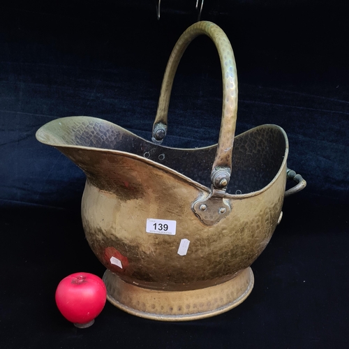 139 - A large antique brass fire scuttle with handle to side.