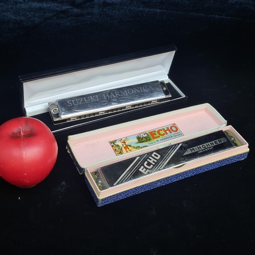 147 - Two superb vintage harmonicas including a German M.Hohner example and a Japanese Suzuki example. Bot... 