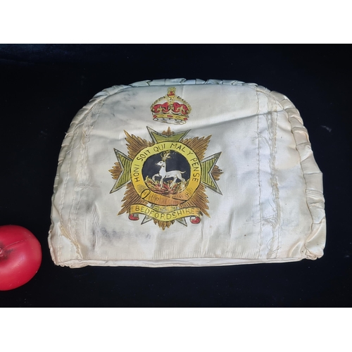 154 - A fascinating hand stitched and hand painted commemorative handwarmer.