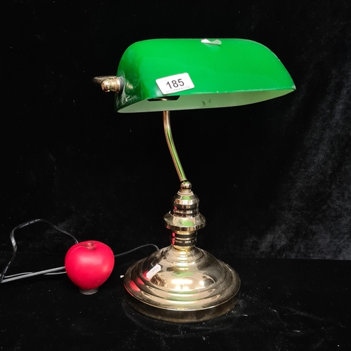 185 - A handsome example of a brass bankers lamp featuring a green glass shade.