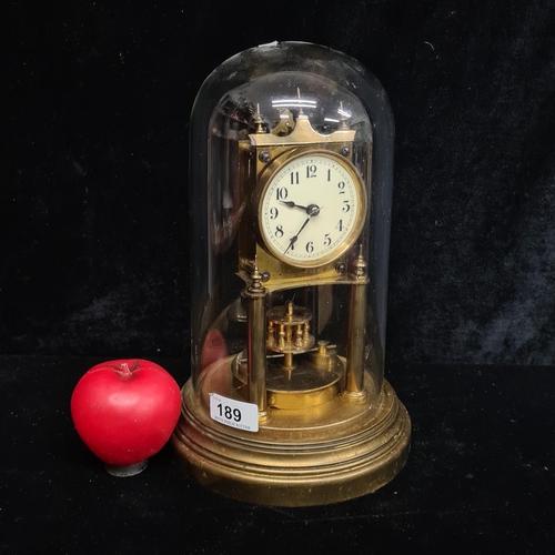 189 - A very handsome vintage brass anniversary clock with a glass dome. Lovely example in good order.