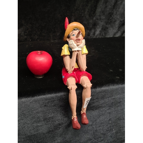 199 - A charming hand painted figure of a sitting Pinocchio. Can sit like this or can sit on an edge of a ... 