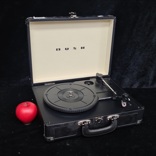 210 - A portable BUSH classic turntable. In good condition. No cable.