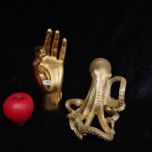 213 - Two gilt items including an octopus figure and a hand gesture figure from a top UK interior design c... 