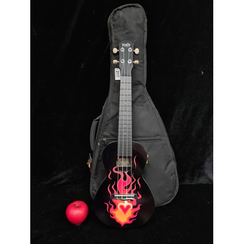 217 - A fantastic Korala Concert Ukulele Polycarbonate, Black with Flame. Comes with smart nylon travel ca... 