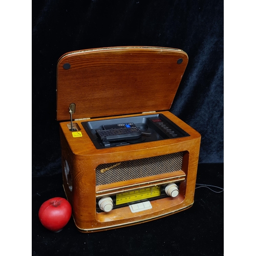 229 - A Roadstar vintage style radio with an integrated CD player, wonderful wooden exterior with brass tr... 