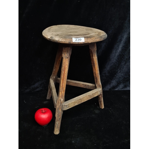 230 - A fabulous early 1800's wooden milking stool. In good condition for it's age.